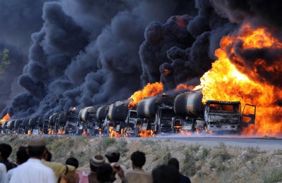 a-row-of-oil-tankers-burn.jpg